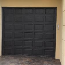 Walnut Wood Grain Garage Doors Installed in Gulf Breeze, FL 1